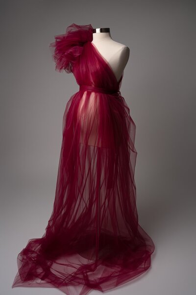 Sheer berry-toned tulle maternity gown with strapless neckline and textured skirt – studio wardrobe option