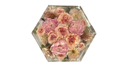 large resin frame with brides bright and colorful wedding flowers preserved inside