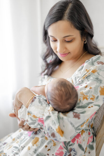 Luxury natural light newborn portrait of Tampa baby boy swaddled in neutral tones