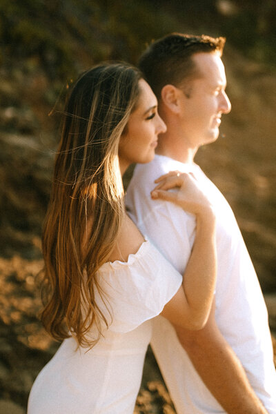 Golden hour couple embracing and smiling