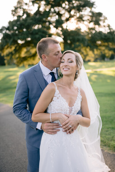 Bride and groom in field