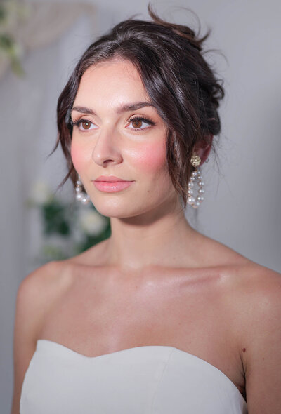 Shimmering peach elegant modern bridal makeup