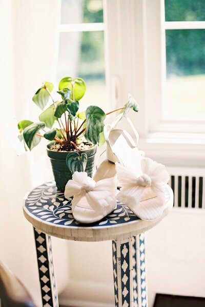 Image of Brides Shoes at a Wisconsin Wedding - Taken by Emily Barbara Wisconsin Wedding Photographer
