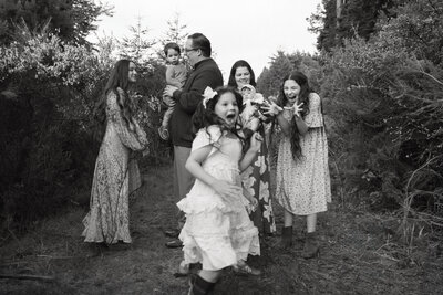 A joyful family enjoying a relaxed and playful Christmas portrait session in Los Angeles, capturing fun, natural moments instead of stiff poses.