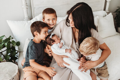 mom with three boys and a newborn girl