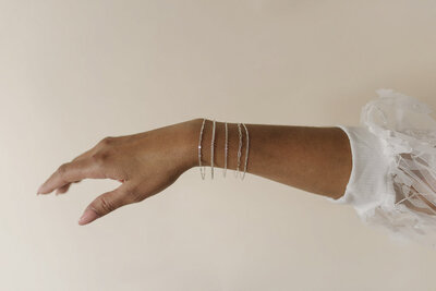 a woman's hand showcasing jewelry