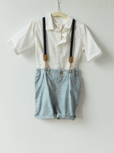 blue seersucker shorts with suspenders and white collared shirt