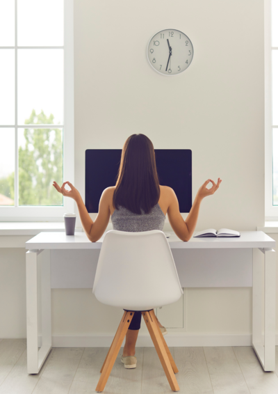 Woman in front of the computer meditating