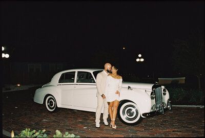 Tampa Florida wedding couple standing in front of classic car coordinated by Day of Details