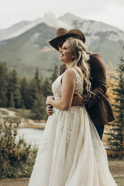 Couple kissing during their wedding photos. Lake Bomoseen, Vermont. Vermont wedding photographer. Luxury wedding photographer.