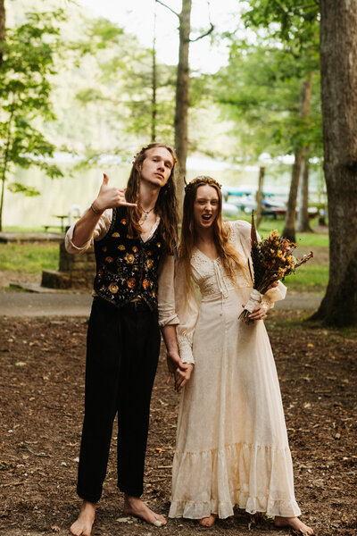 A dope wedding couple pose for the camera.