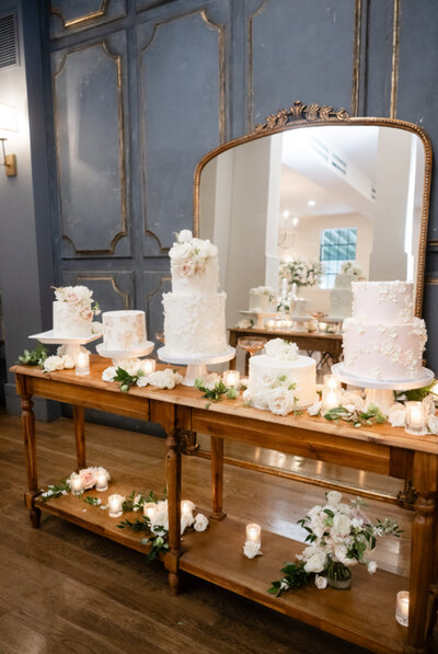 wedding cake designs sitting on table decorated with florals