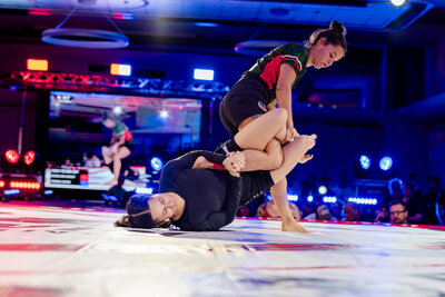 Two women in leg lock entanglement at F2W. Submission almost secure via heel hook