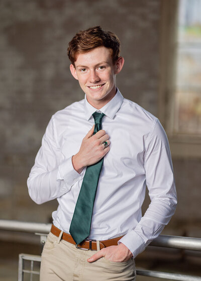 A high school senior posing for his senior portrait in Columbia, South Carolina