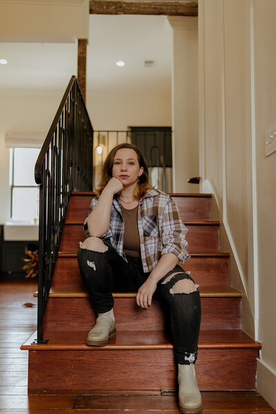 woman posing on stairs