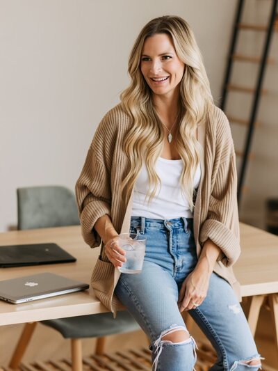 Photo of Boots and Champagne in a glass celebrating business goals. 