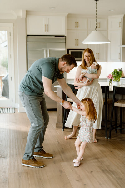 couple holding newborn
