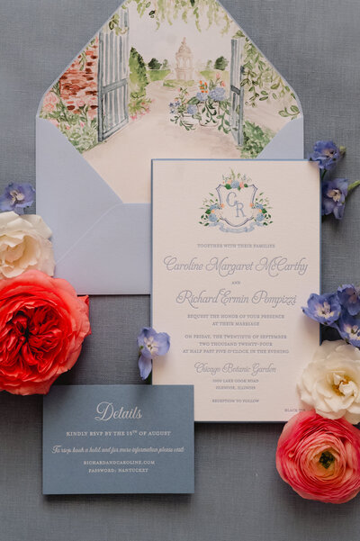 An elegant wedding invitation with various flowers. 