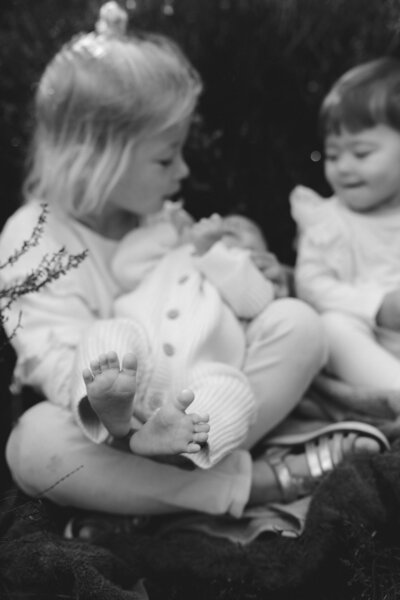 photo of a newborn baby with a soft toy rabbit