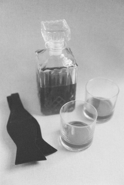 Caitlin Wilcox Photography | Wedding Photographers in Richmond VA | black and white film image of whiskey and a black bow tie