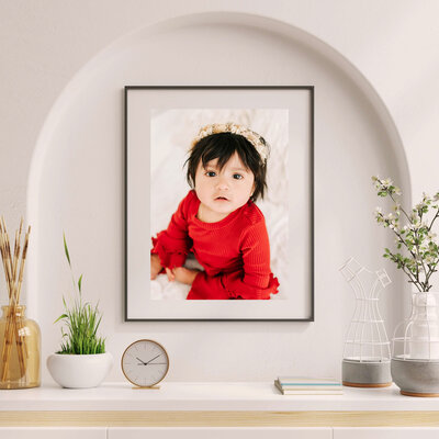 Branson MO baby milestone photographer The XO Photography captures framed photo of baby girl in red