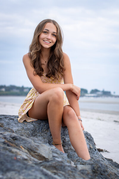 Outdoor senior photo session on a Scarborough beach at sunset.