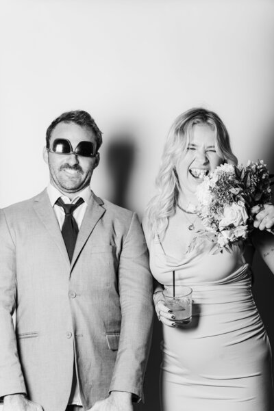 Black and white portrait of a modern couple in formal attire, captured at a Vogue Portrait photo booth in Richmond, VA.