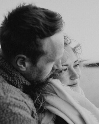 Man leaning her head against his fiancé's head in Espoo in Finland