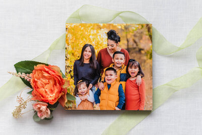 A mom laughs with her children preserved on a standout to hang in her home by Laramee Love Photography