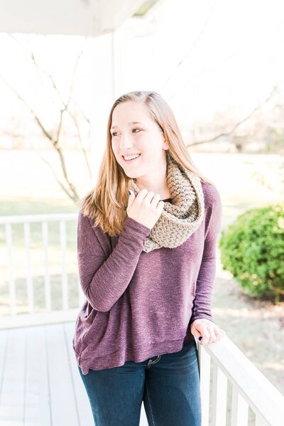 Katie Fri Photography smiling on a porch