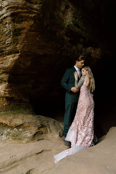 Couple embracing in a cave at Hocking Hills.