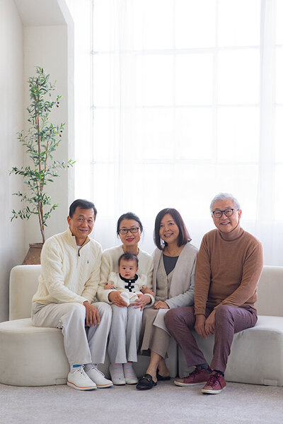 Grandparents smiling with first grandchild at studio in DTLA