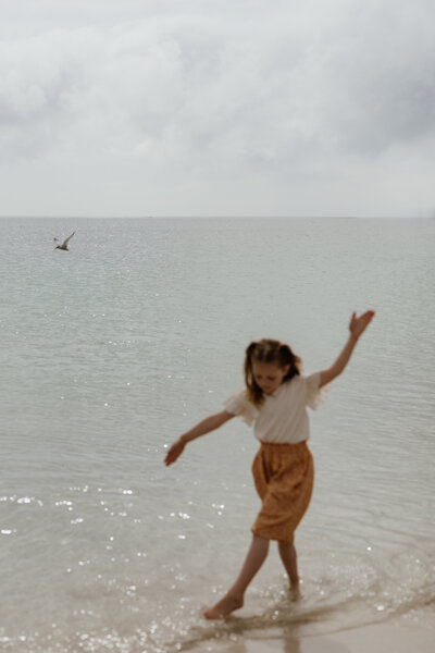 girl dances in the water
