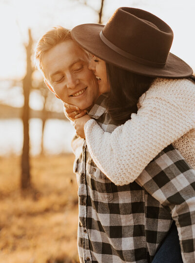 piggy back riding in the sunset for dallas engagement photos