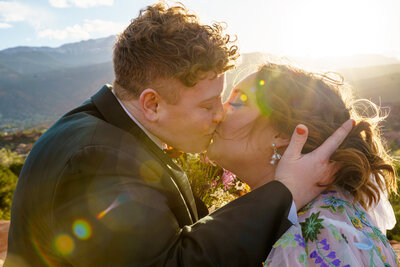Vibrant Wedding Photographer in Colorado Springs, Bridal Portrait with stunning cape at Baldoria on the Water.