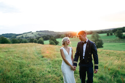 couple-walk-together-in-countryside-at-luxury-wedding-in-hampshire