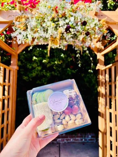 Mini charcuterie box with tea sandwiches, fruits and nuts