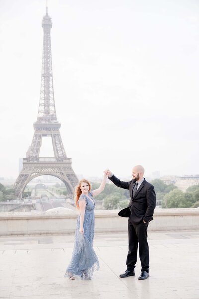 Wedding Photographer Maria McKenzie Photography Twirling in front of the Eiffel Tower in Paris