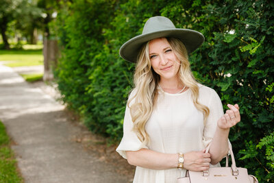 Canadian Realtor Tamara standing on the sidewalk of a property.
