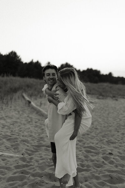 Playful engagement session on the beach in Duluth, Minnesota.