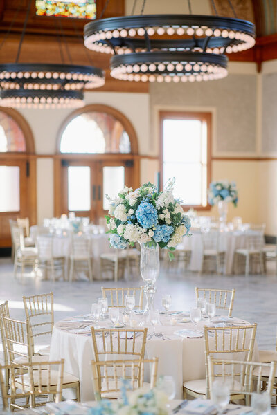 Wedding reception tablescape with blue flowers at Ashton Depot in Fort Worth by Kortney Boyett Photography