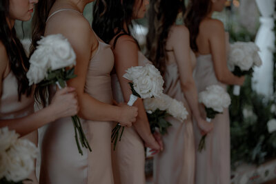 bridesmaids holding small flower bouquets