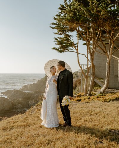 bride and groom under the trees