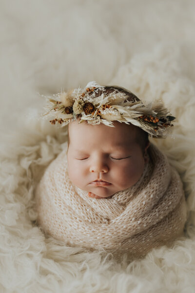 baby wrapped sleep in a newborn photography session