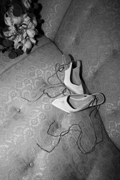 Brides shoes heels on vintage yellow couch