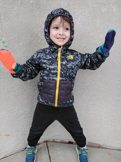 Boy with Smile in Winter Clothes CPC Albuquerque Childcare