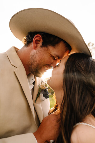 Cowboy kissing his bride