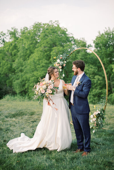 Married couple releasing butterflies during their ceremony