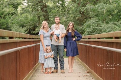 family posing on bridge during session in york pa photographer
