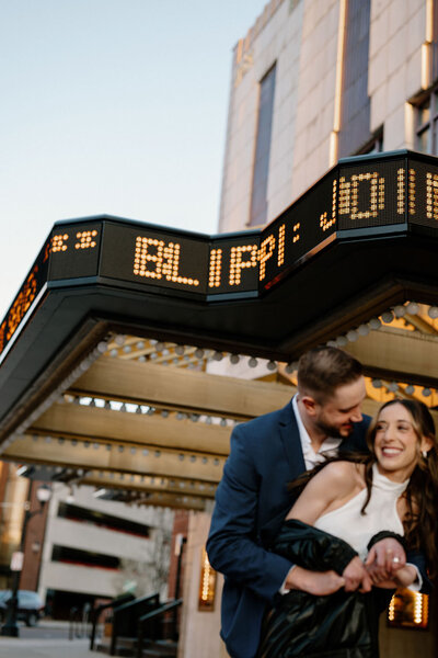 Couple walking hand in hand through the streets of NYC during their intimate city elopement